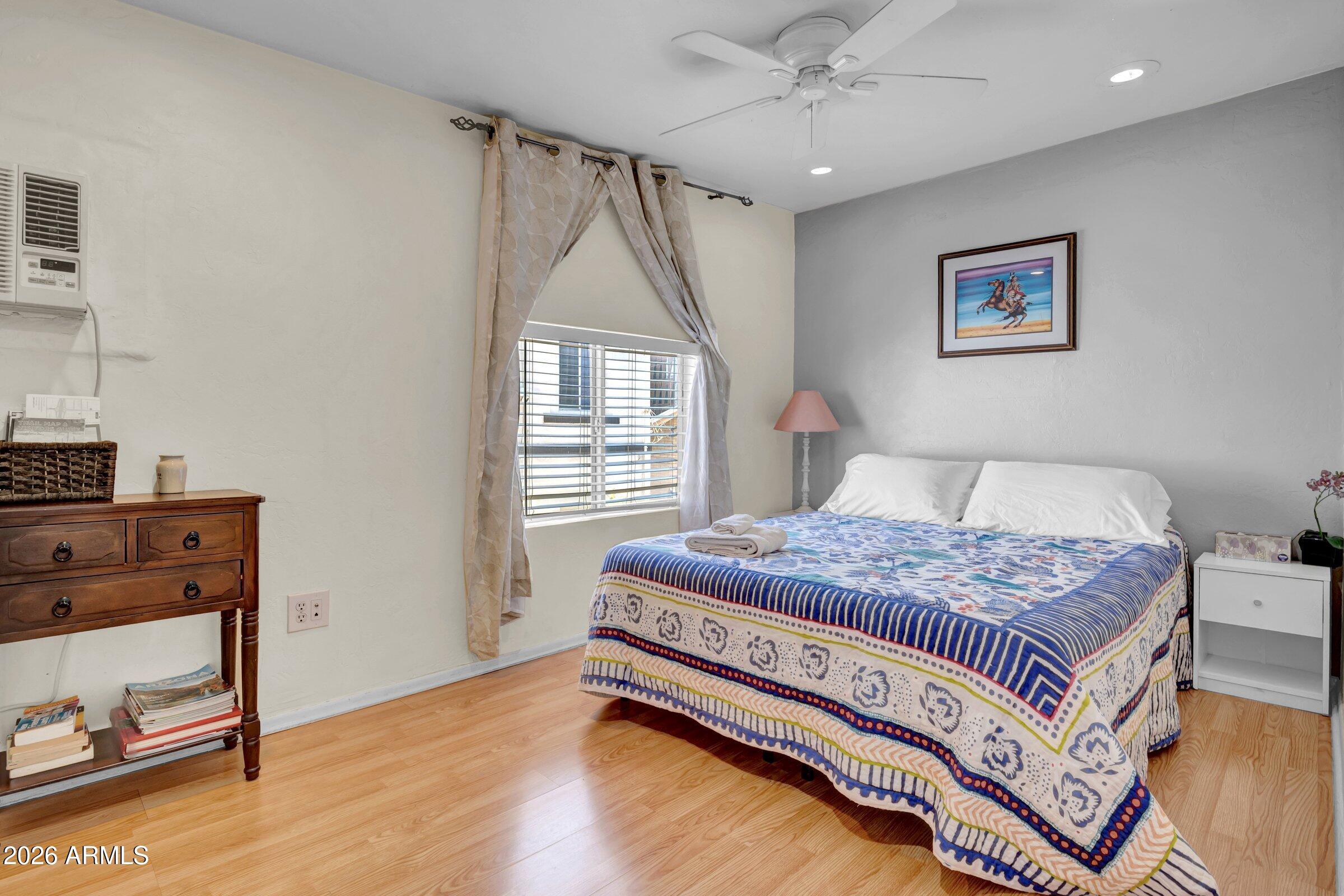 712 East Pierce Street Phoenix, AZ 85006 - Photo 31 of 39 a bedroom with a bed and a window