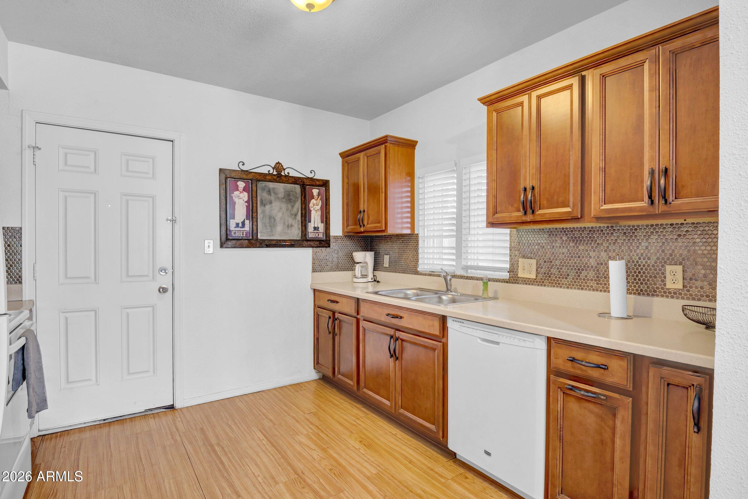 712 East Pierce Street Phoenix, AZ 85006 - Photo 35 of 39 a kitchen with a sink cabinets and window