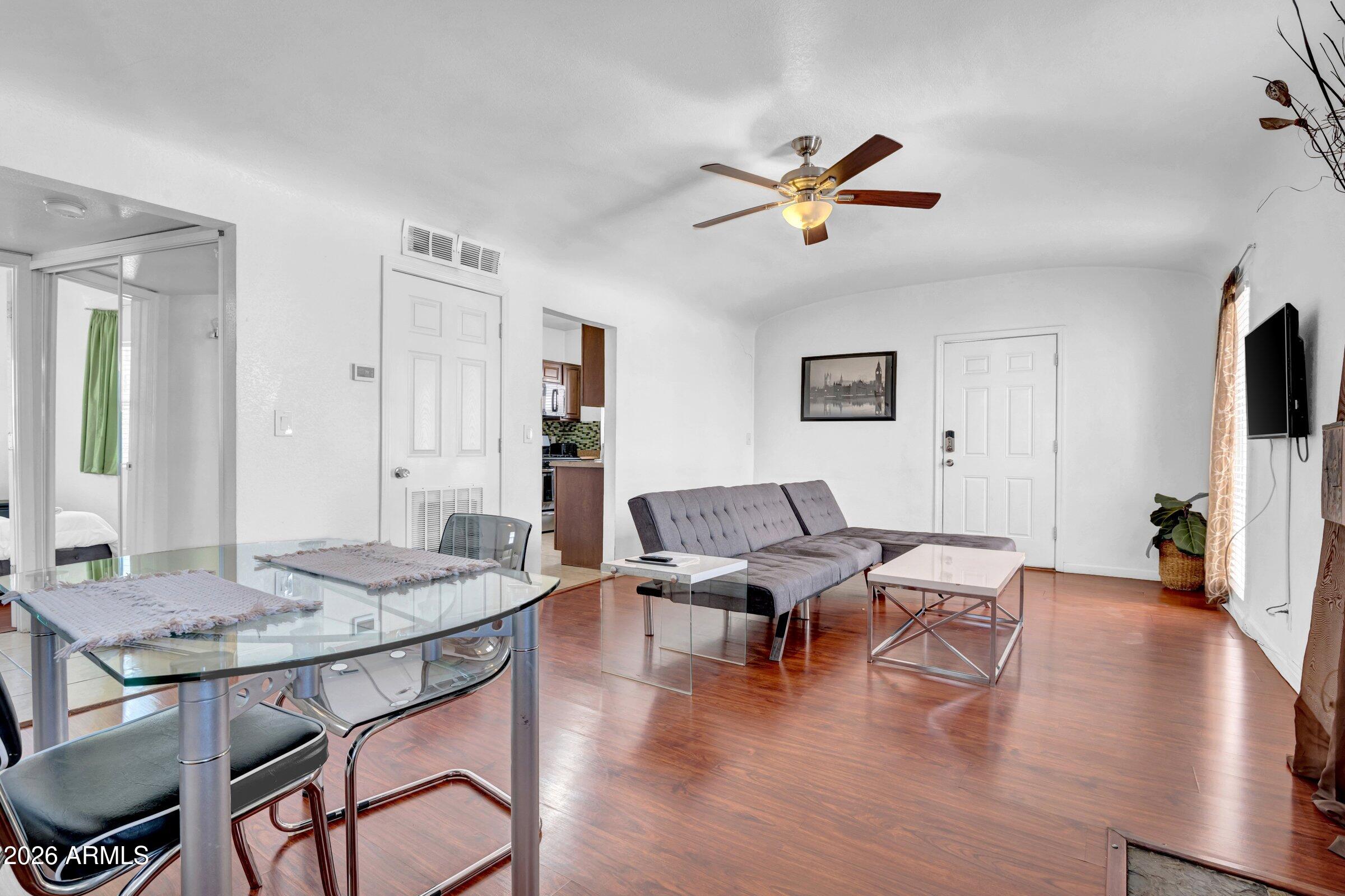 712 East Pierce Street Phoenix, AZ 85006 - Photo 7 of 39 a living room with furniture and a wooden floor