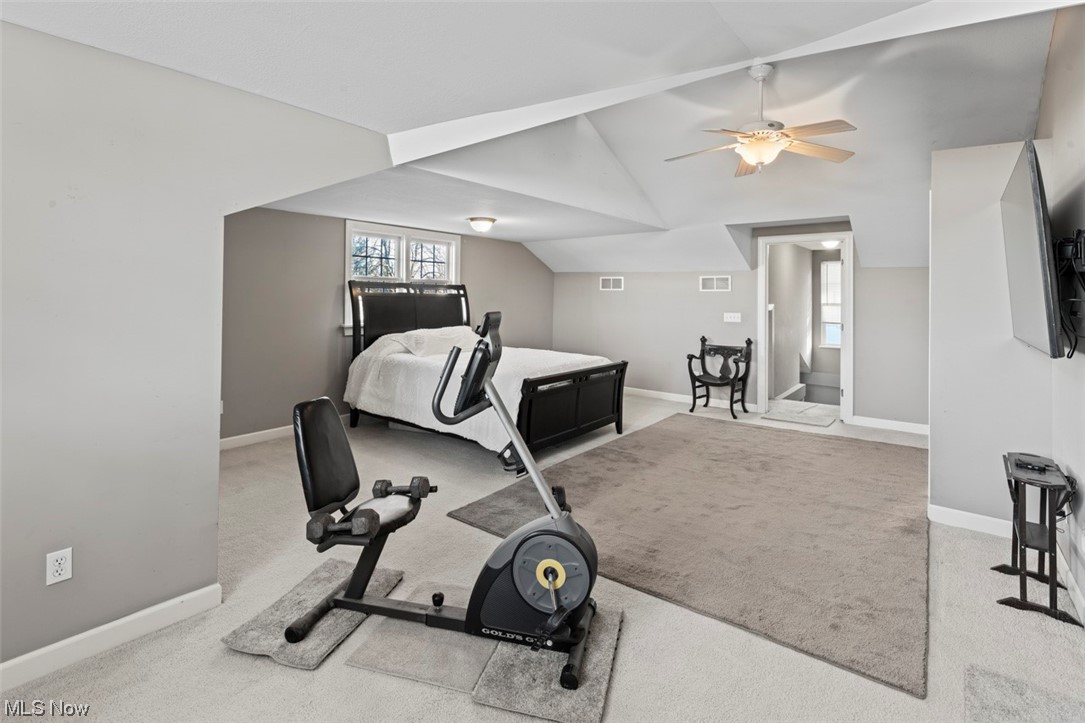 4275 West Calla Road Canfield, OH 44406 - Photo 15 of 31 Exercise area with lofted ceiling, ceiling fan, and light colored carpet