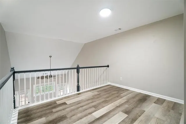 a view of staircase with wooden floor