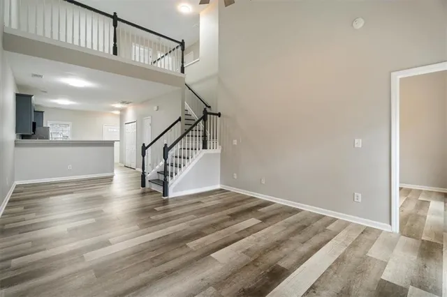 a view of entryway and hall with wooden floor