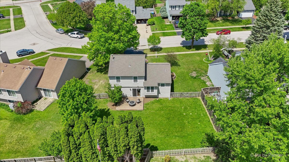 1150 Appleton Lane Geneva, IL 60134 - Photo 30 of 43 an aerial view of a house with a garden and trees