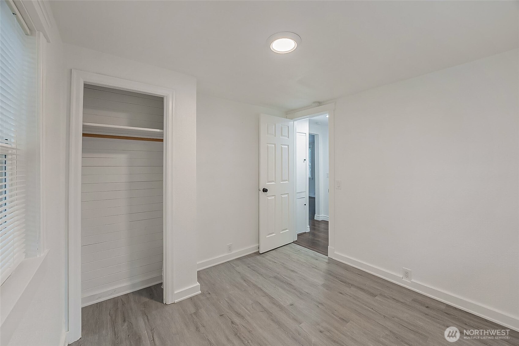 1607 Harrison Street Steilacoom, WA 98388 - Photo 18 of 37 a view of an empty room with wooden floor and closet