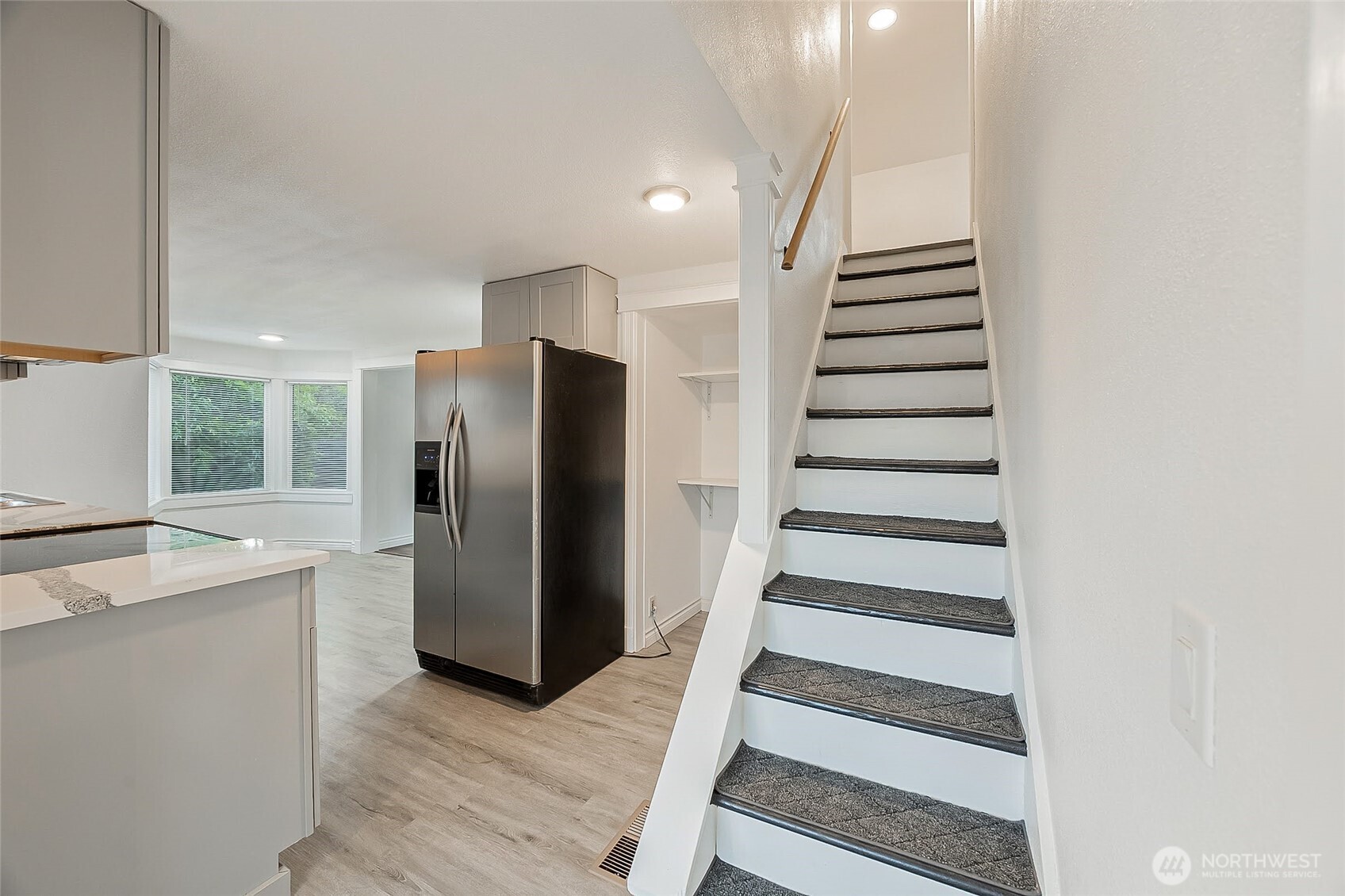 1607 Harrison Street Steilacoom, WA 98388 - Photo 20 of 37 a view of a kitchen with wooden floor and electronic appliances
