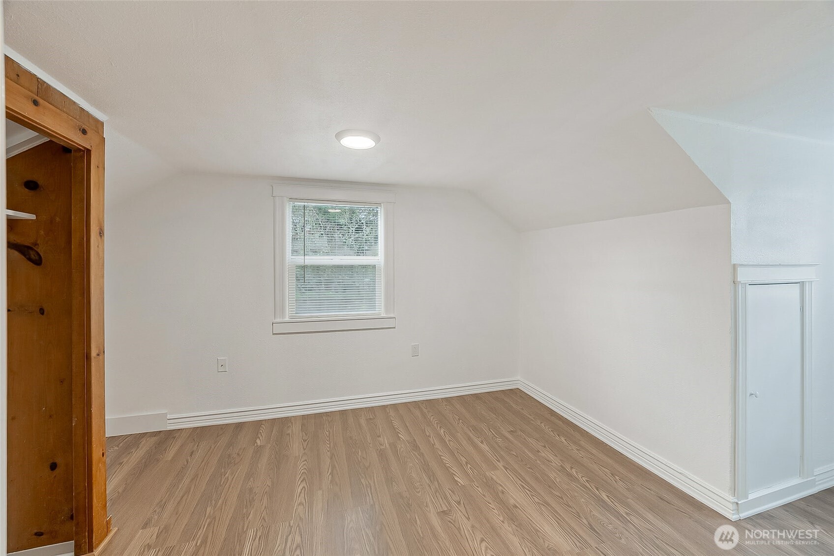 1607 Harrison Street Steilacoom, WA 98388 - Photo 22 of 37 an empty room with wooden floor and window