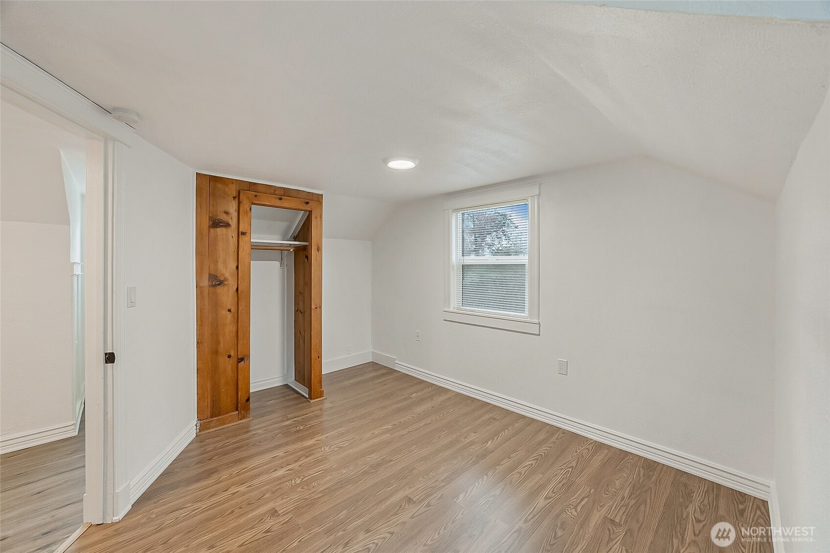 1607 Harrison Street Steilacoom, WA 98388 - Photo 23 of 37 a view of an empty room with wooden floor and closet