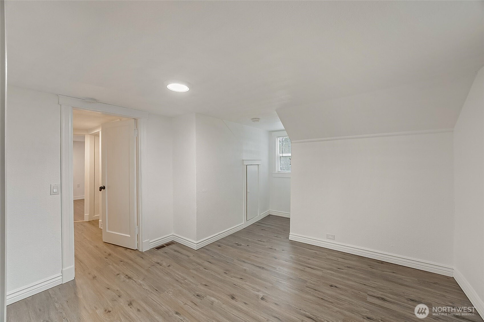 1607 Harrison Street Steilacoom, WA 98388 - Photo 25 of 37 a view of an empty room with wooden floor