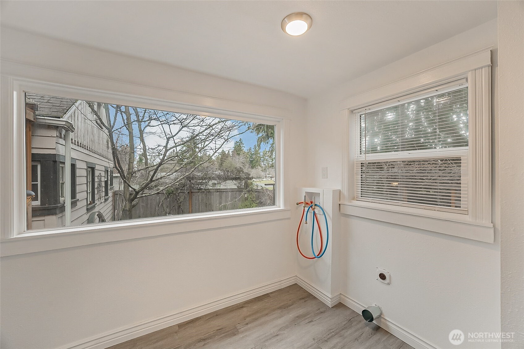 1607 Harrison Street Steilacoom, WA 98388 - Photo 27 of 37 a bathroom with a window sink and shower