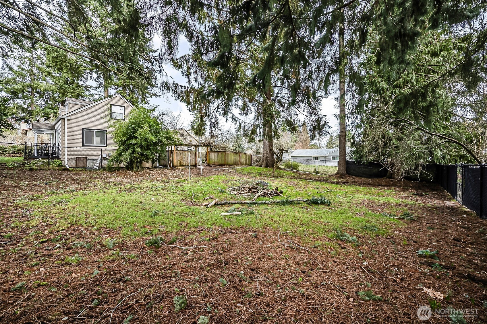 1607 Harrison Street Steilacoom, WA 98388 - Photo 32 of 37 a view of a yard with plants and trees