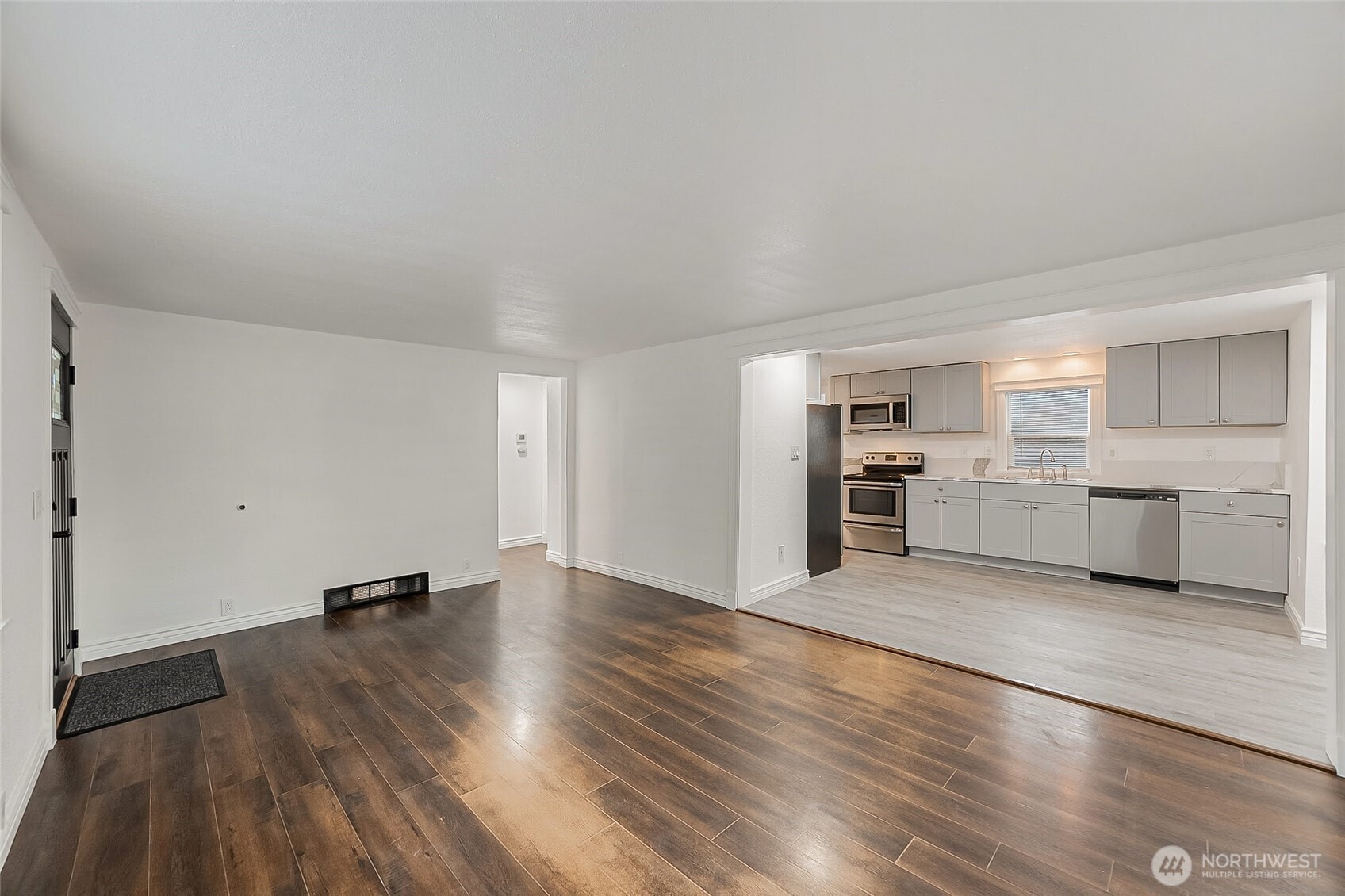 1607 Harrison Street Steilacoom, WA 98388 - Photo 7 of 37 a view of a kitchen with a sink and a stove top oven