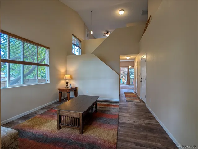 a livingroom with furniture and wooden floor