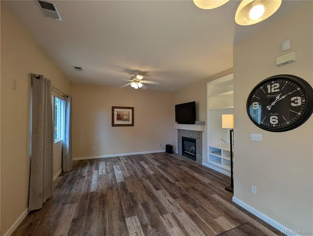 a view of a livingroom with furniture a fireplace