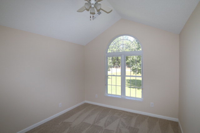1644 Klopfer Road Juliette, GA 31046 - Photo 4 of 16 an empty room with a window and chandelier