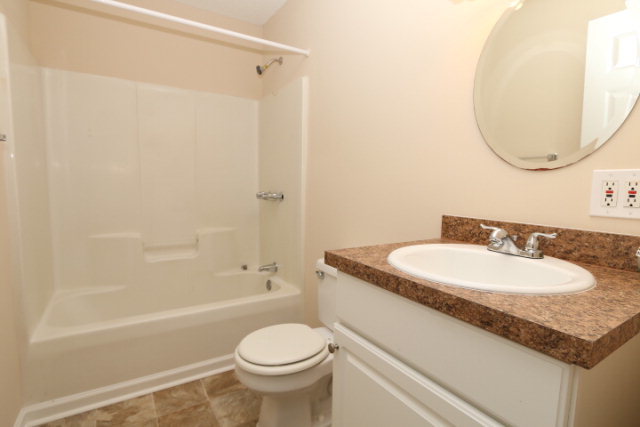 1644 Klopfer Road Juliette, GA 31046 - Photo 6 of 16 a bathroom with a granite countertop sink toilet and shower