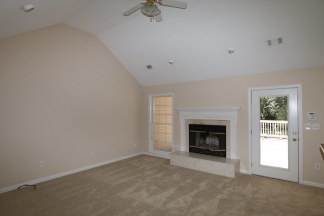 1644 Klopfer Road Juliette, GA 31046 - Photo 10 of 16 an empty room with windows and fireplace