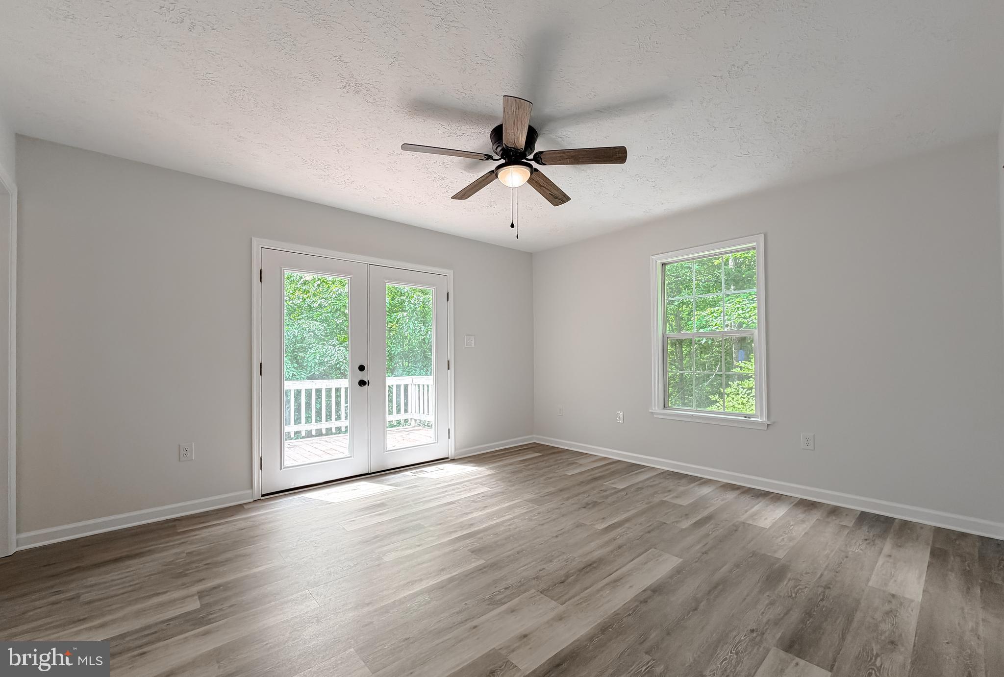 39655 Persimmon Creek Road Mechanicsville, MD 20659 - Photo 15 of 35 Primary Bedroom with Door to Deck
