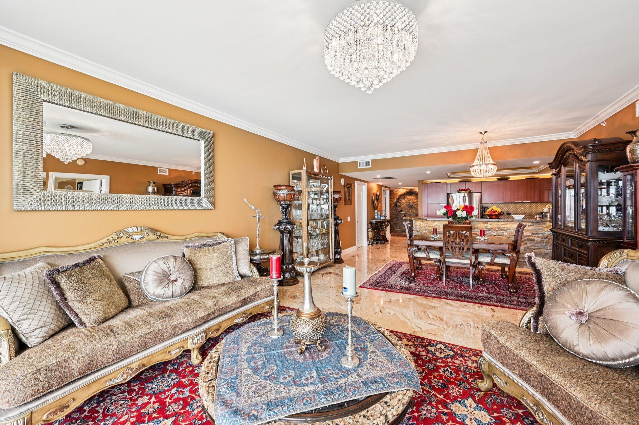 2640 Lake Shore Drive, Unit 1510 Riviera Beach, FL 33404 - Photo 12 of 52 a living room with furniture and a rug