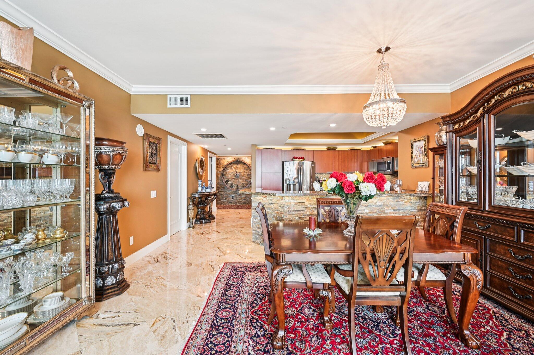 2640 Lake Shore Drive, Unit 1510 Riviera Beach, FL 33404 - Photo 16 of 52 a view of a dining room with furniture window and wooden floor