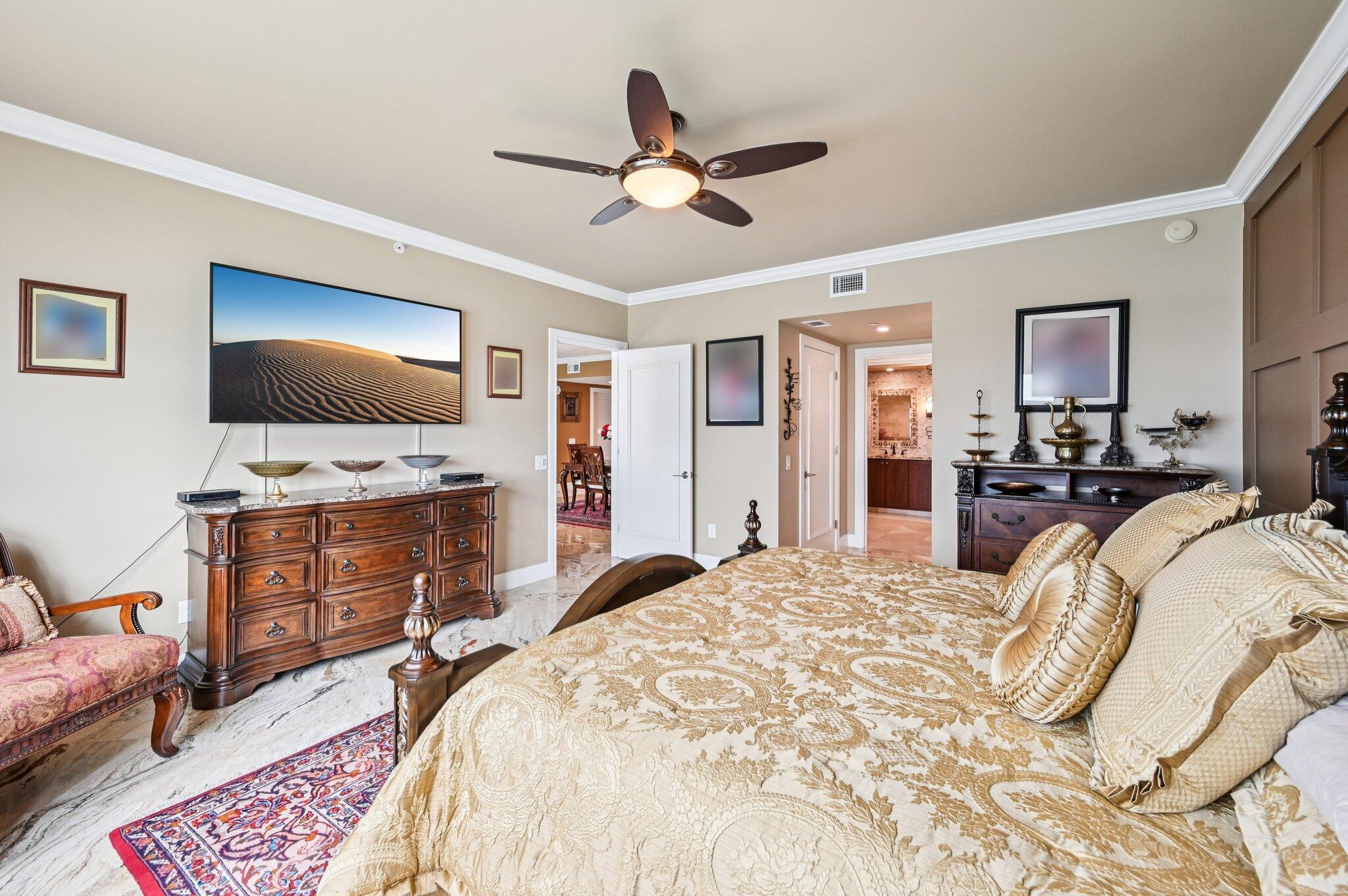 2640 Lake Shore Drive, Unit 1510 Riviera Beach, FL 33404 - Photo 31 of 52 a bedroom with a bed and a flat screen tv