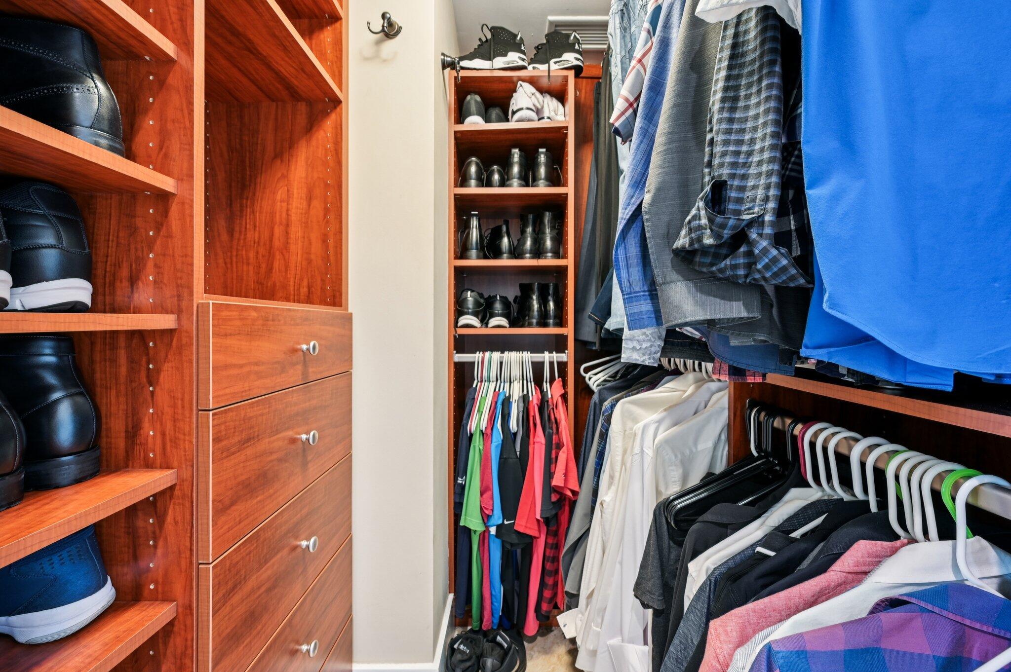 2640 Lake Shore Drive, Unit 1510 Riviera Beach, FL 33404 - Photo 35 of 52 a view of walk in closet with clothes and shoes