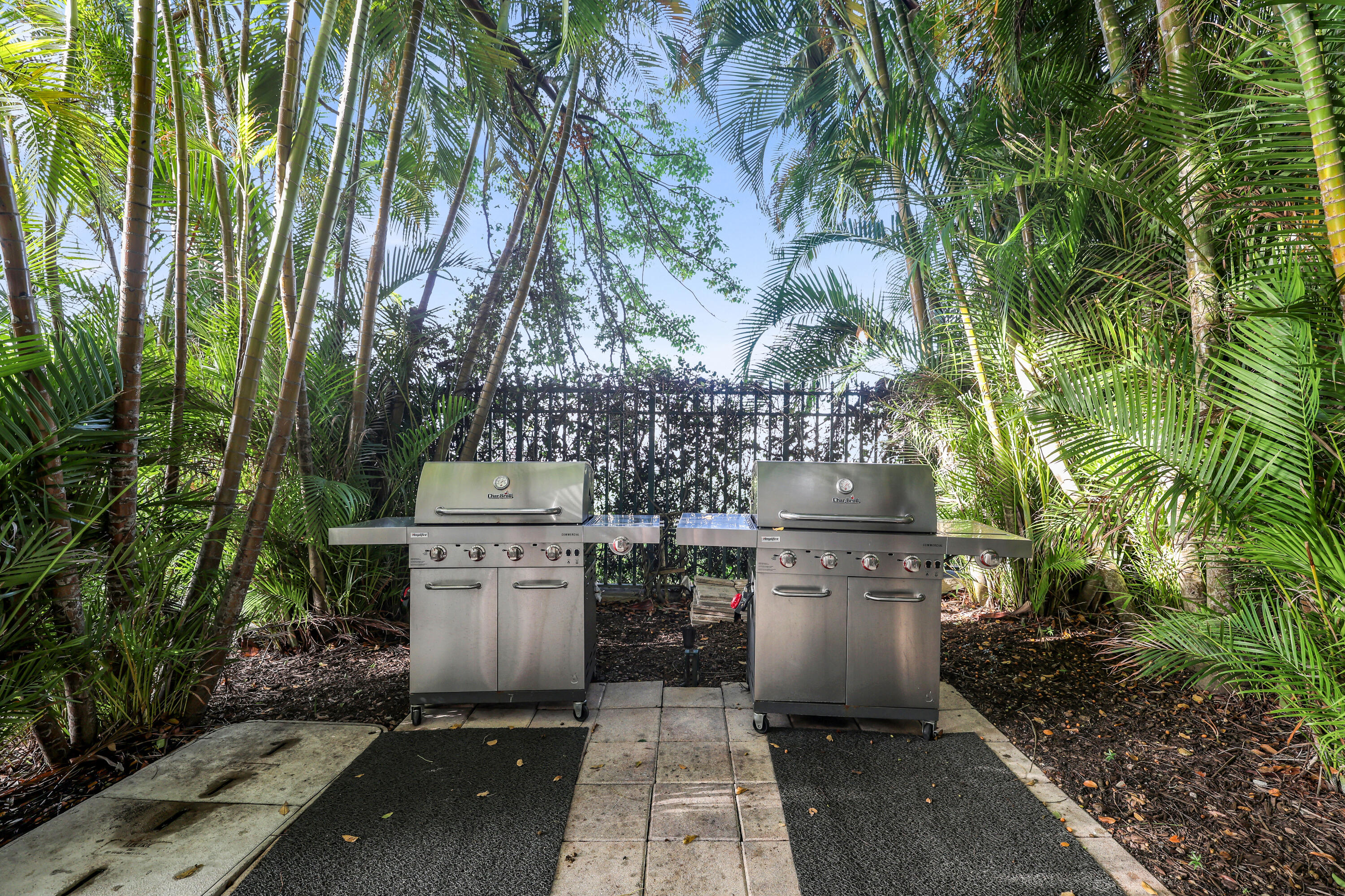 2640 Lake Shore Drive, Unit 1510 Riviera Beach, FL 33404 - Photo 38 of 52 a utility room with multiple dryer and plants