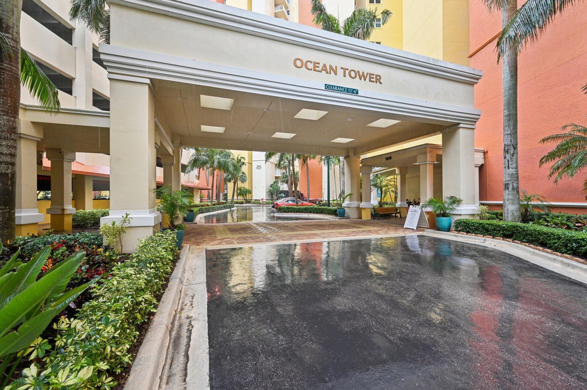 2640 Lake Shore Drive, Unit 1510 Riviera Beach, FL 33404 - Photo 5 of 52 a view of a building with a umbrellas on the street