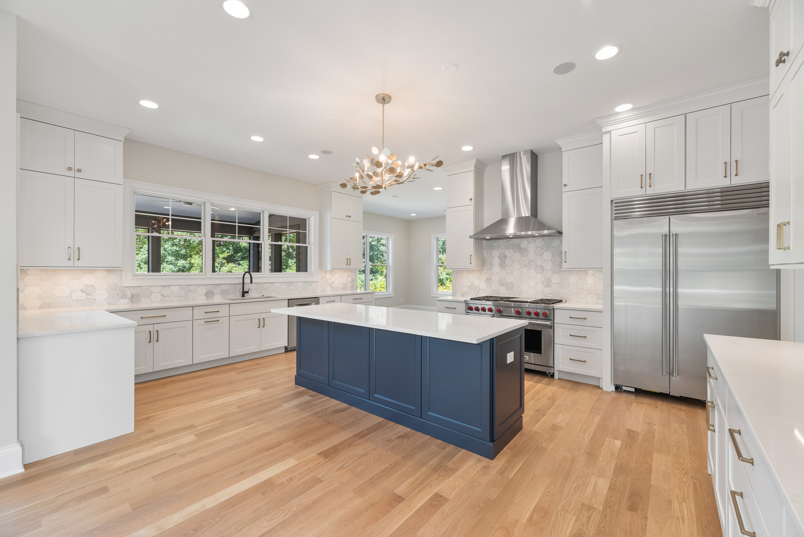 1959 Windridge Drive Lake Forest, IL 60045 - Photo 18 of 64 a room with kitchen island granite countertop a sink cabinets and stainless steel appliances