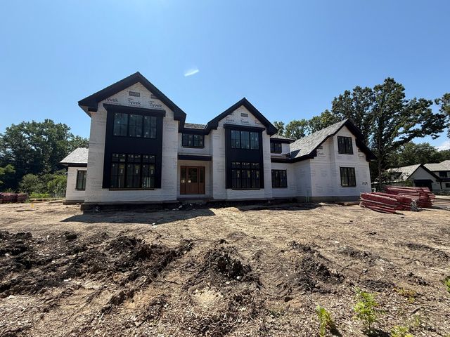 a view of a kitchen with large windows