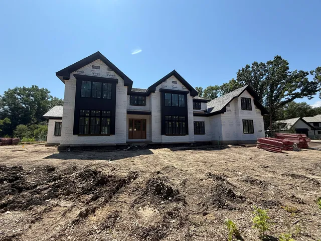 a view of a kitchen with large windows