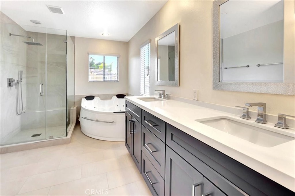 17 Marquesa Dana Point, CA 92629 - Photo 12 of 20 a spacious bathroom with a double vanity sink toilet mirror and shower