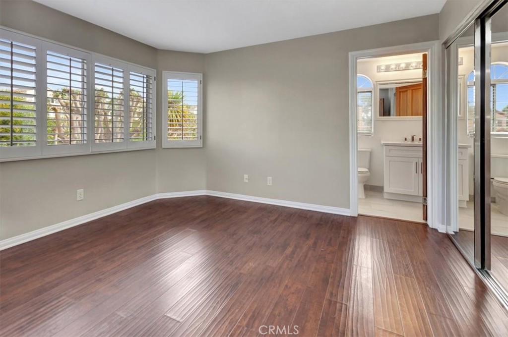 17 Marquesa Dana Point, CA 92629 - Photo 13 of 20 an empty room with wooden floor and windows