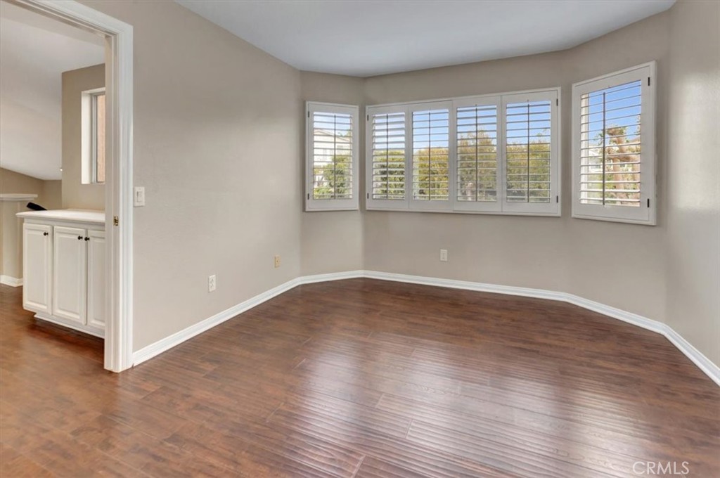 17 Marquesa Dana Point, CA 92629 - Photo 14 of 20 an empty room with wooden floor and windows