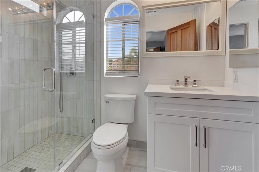 17 Marquesa Dana Point, CA 92629 - Photo 15 of 20 a bathroom with a sink a toilet and shower