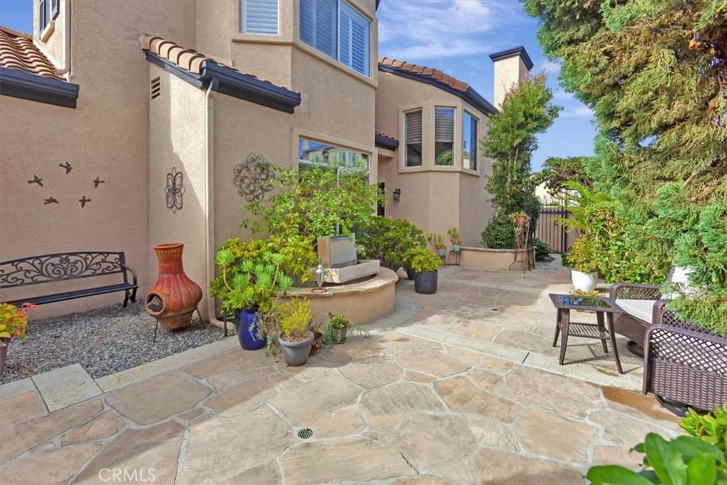 17 Marquesa Dana Point, CA 92629 - Photo 2 of 20 a view of a backyard with chair and potted plants