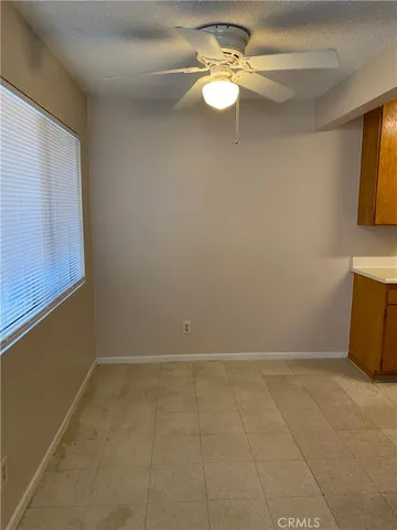 a view of a kitchen with a sink and a window
