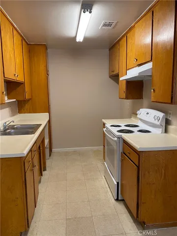 a utility room with a sink a washer and dryer
