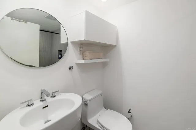 a bathroom with a toilet and sink