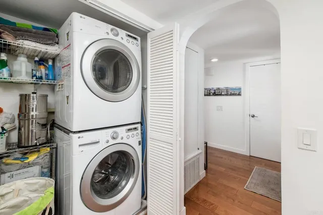 a view of a hallway with washer and dryer