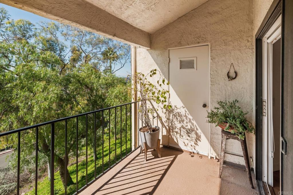 7323 Calle Luna Carlsbad, CA 92009 - Photo 18 of 27 a view of balcony with wooden floor and plants