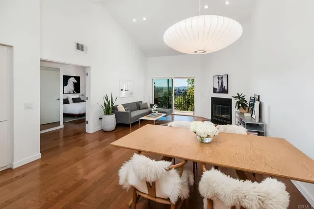 a living room with furniture a table and a fireplace