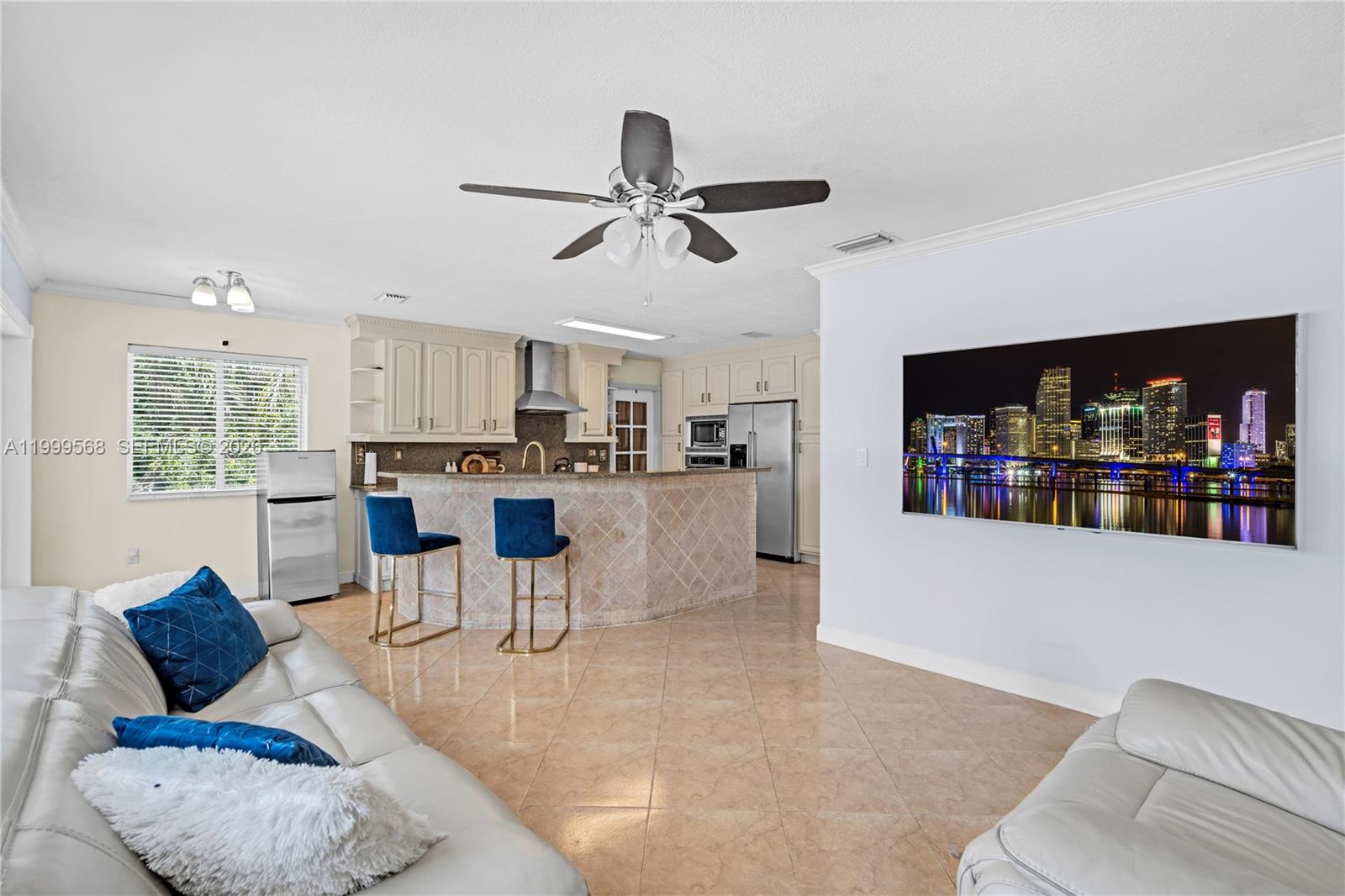13790 Southwest 174th Street Miami, FL 33177 - Photo 11 of 41 a living room with furniture and kitchen view