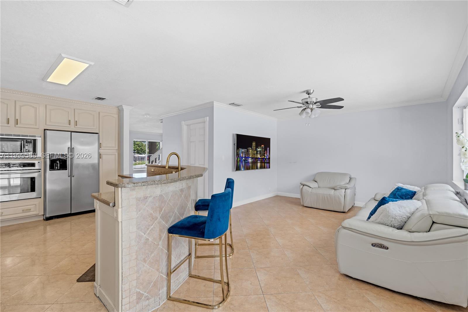 13790 Southwest 174th Street Miami, FL 33177 - Photo 12 of 41 a living room with furniture and kitchen view