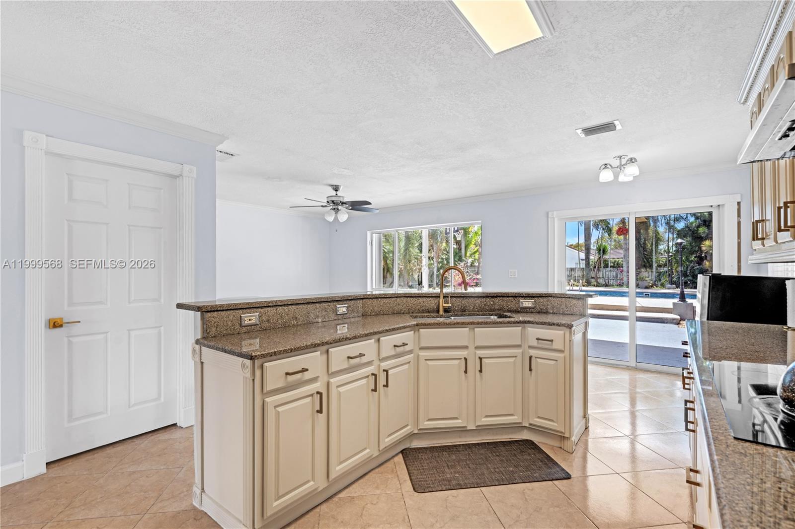 13790 Southwest 174th Street Miami, FL 33177 - Photo 15 of 41 a kitchen with white cabinets and sink