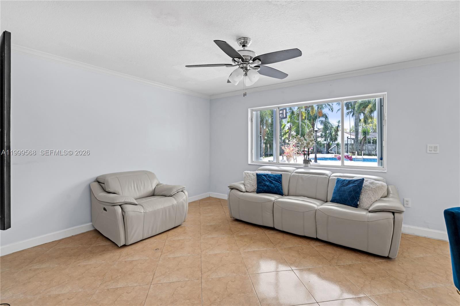 13790 Southwest 174th Street Miami, FL 33177 - Photo 16 of 41 a living room with furniture and a large window