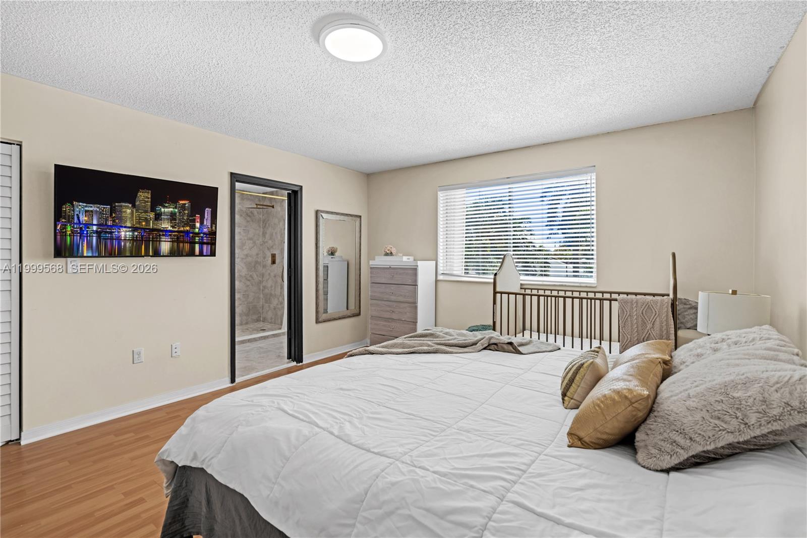 13790 Southwest 174th Street Miami, FL 33177 - Photo 18 of 41 a bedroom with a bed and a window