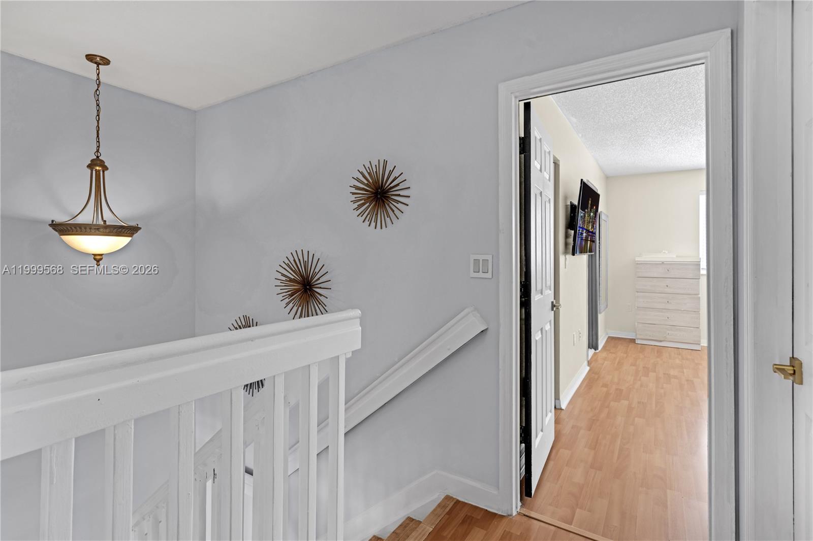 13790 Southwest 174th Street Miami, FL 33177 - Photo 23 of 41 a view of a hallway to a bedroom