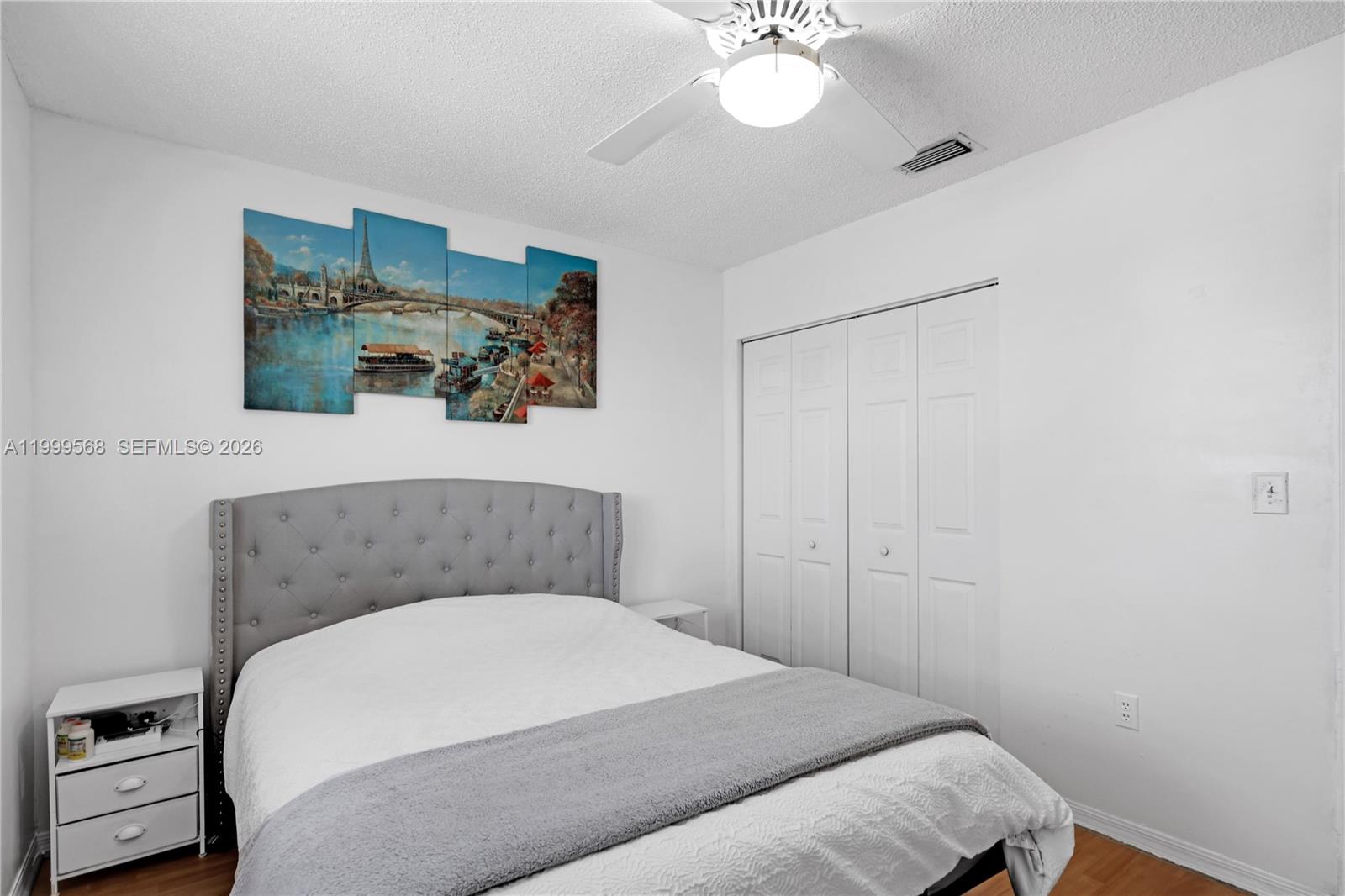 13790 Southwest 174th Street Miami, FL 33177 - Photo 25 of 41 a bedroom with a bed and a chandelier