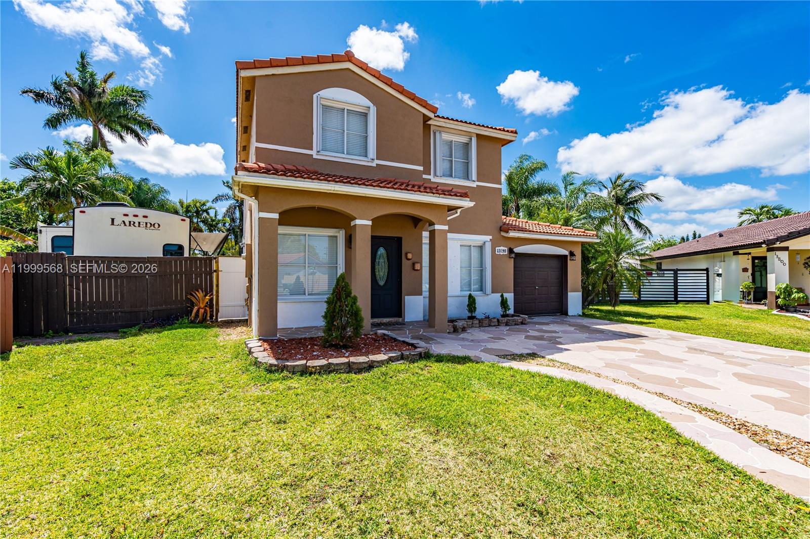 13790 Southwest 174th Street Miami, FL 33177 - Photo 3 of 41 a view of a house with a yard and furniture
