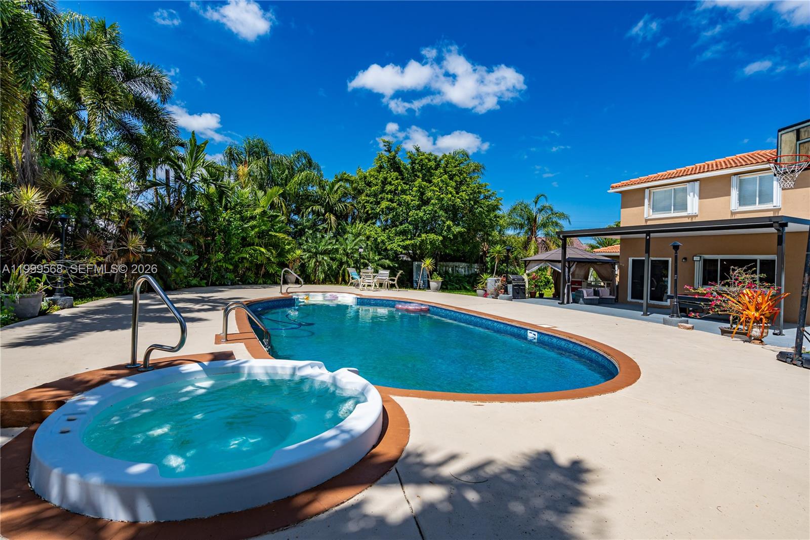13790 Southwest 174th Street Miami, FL 33177 - Photo 33 of 41 a view of a swimming pool with a patio
